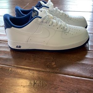 White Air Force ones with blue on trim.
